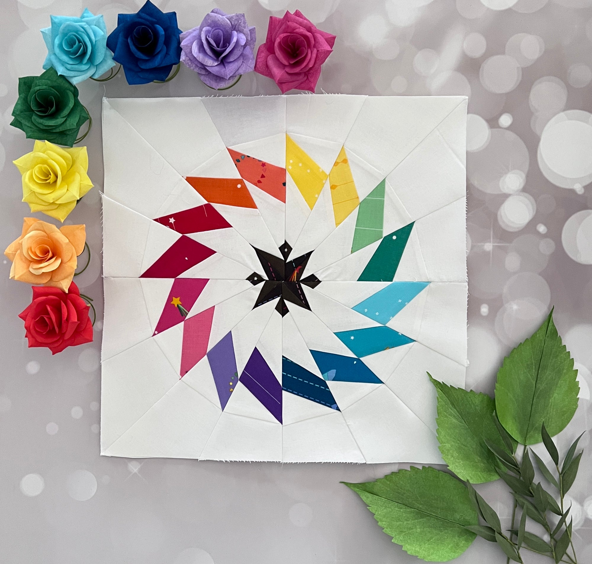 aurora paper pieced pattern sewn in rainbow fabrics