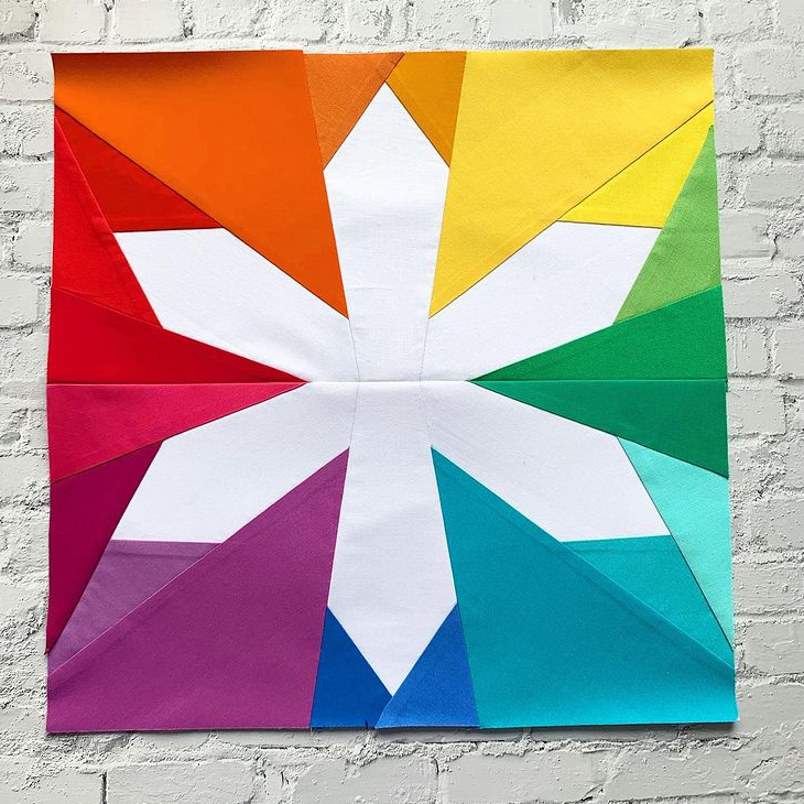 asterisk paper pieced pattern in rainbow fabrics