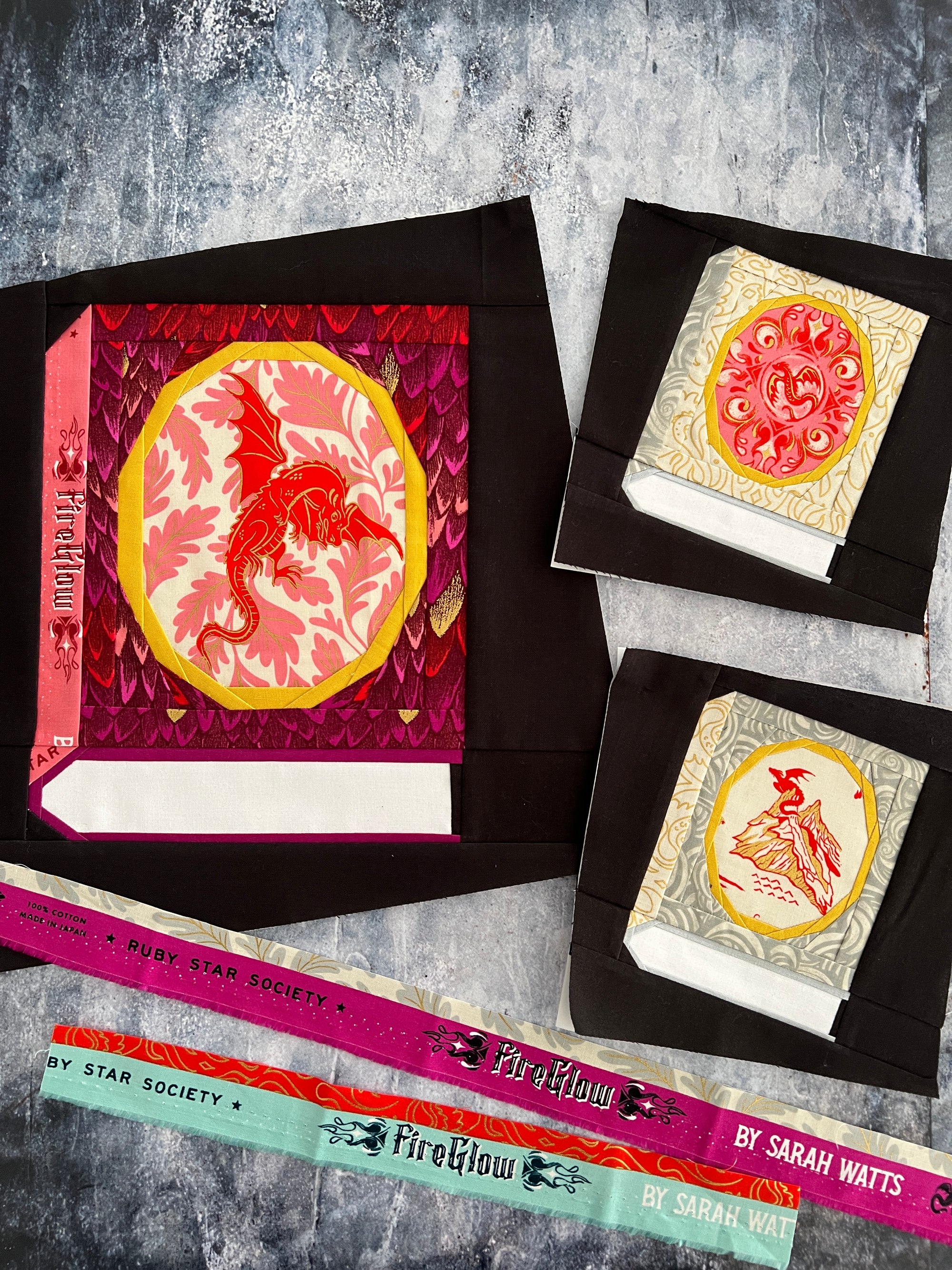 A foundation paper pieced Book block featuring an oval frame for a fussycut fabric feature