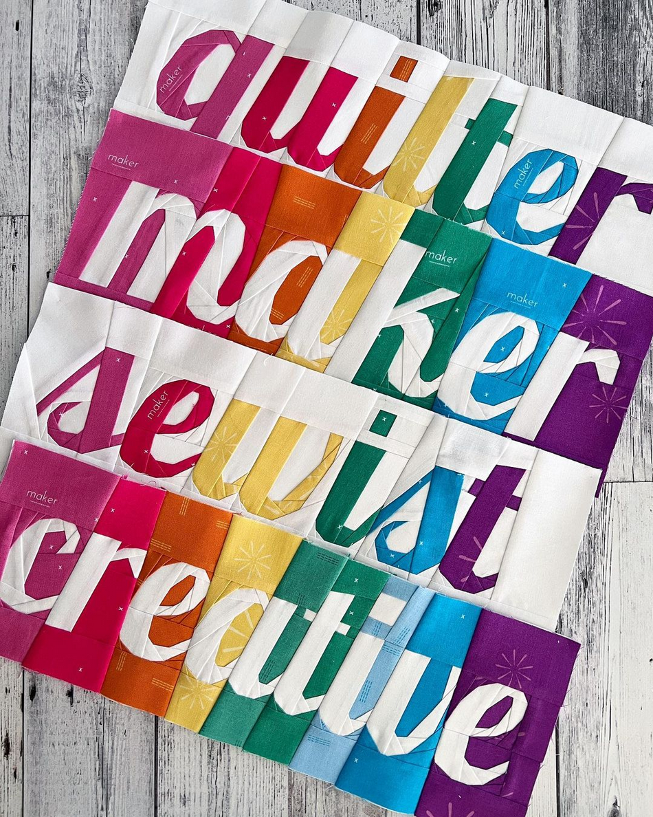 creative themed text blocks paper pieced patterns sewn in rainbow fabric