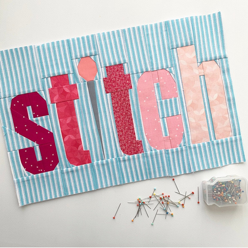 the word stitch paper pieced pattern sewn in fabric