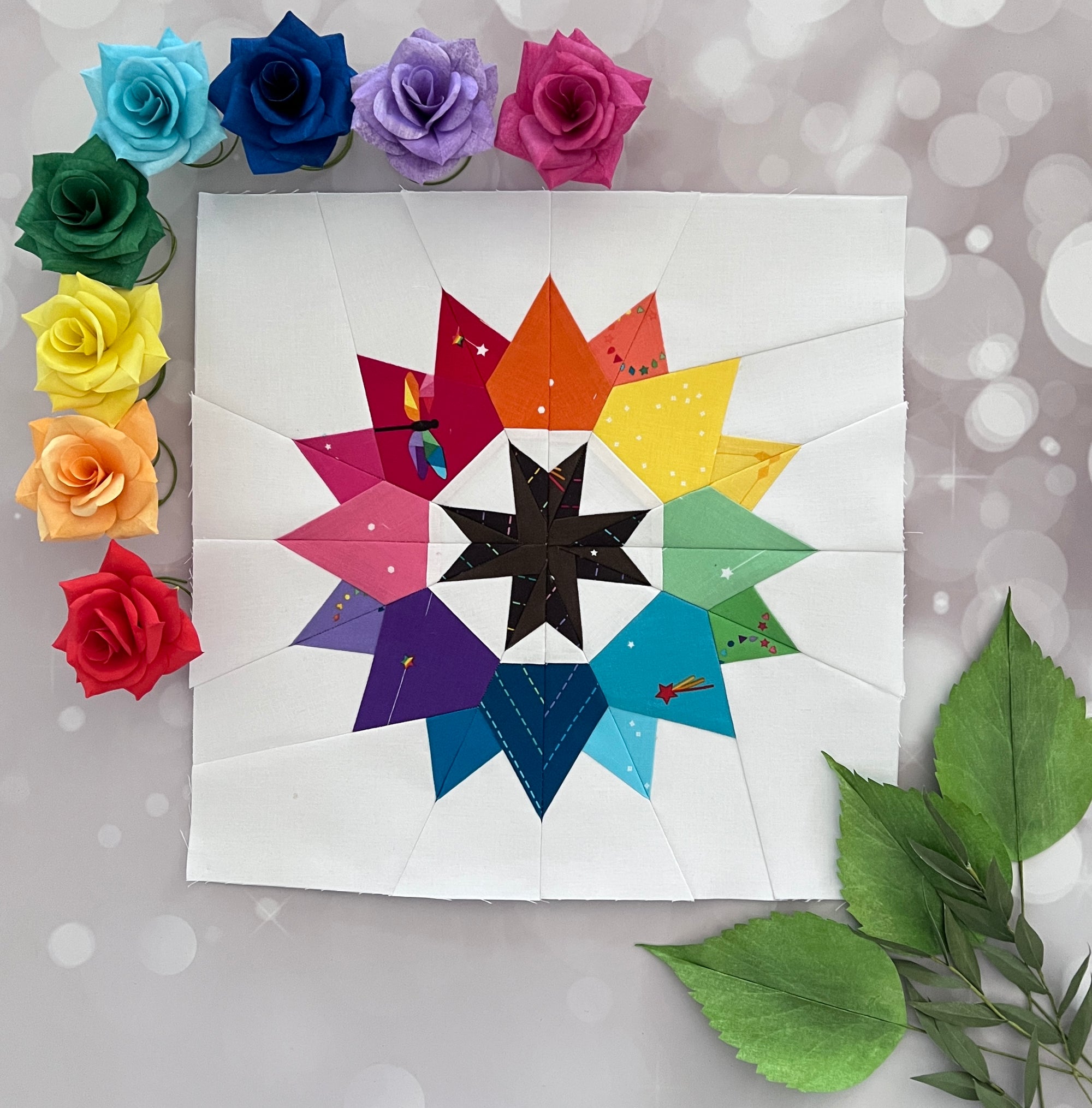 illuminate paper pieced pattern sewn in rainbow fabric