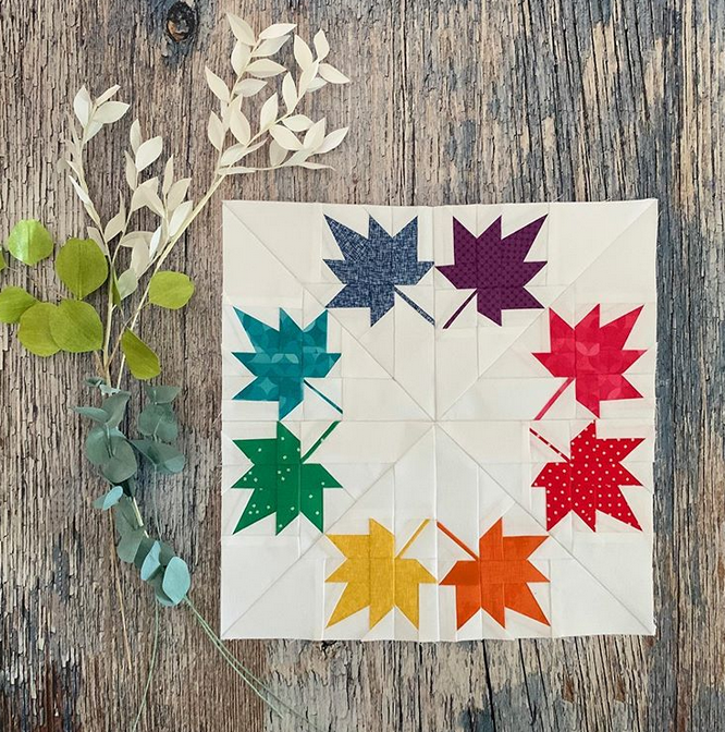 wreath of leaves in rainbow fabric made with a paper pieced pattern