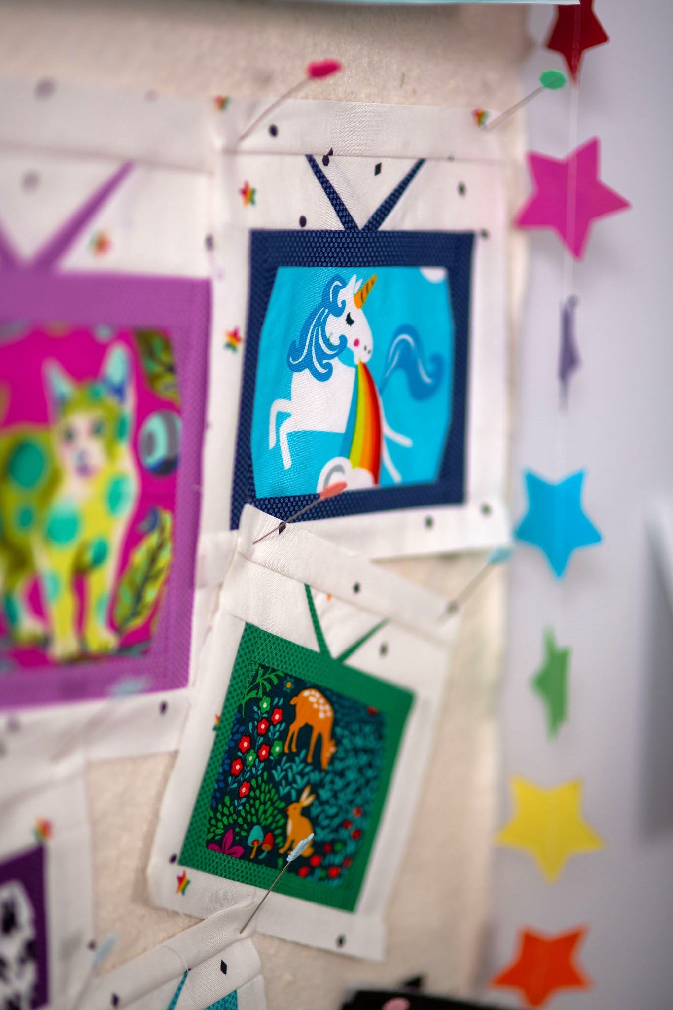 Three bright foundation pieces including a cat, unicorn and rabbit.