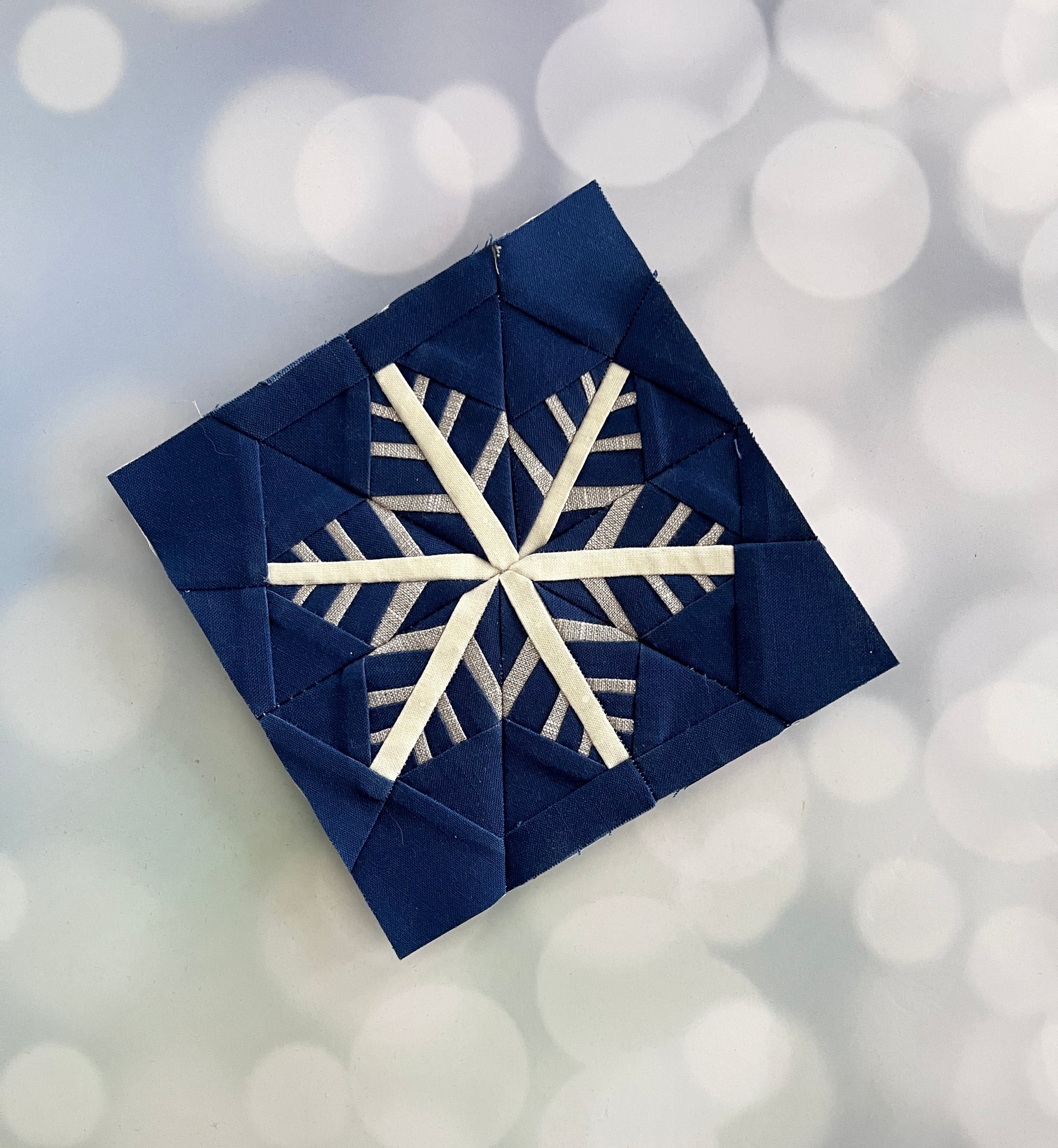 snowflake paper pieced pattern sewn in fabric