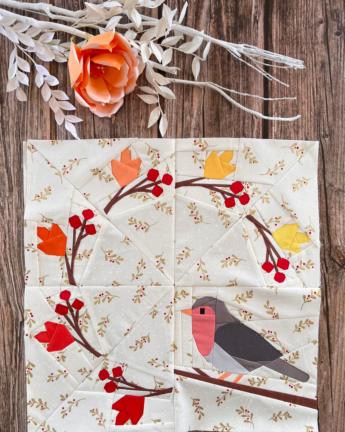 Finished Amongst the Leaves foundation paper pieced quilting pattern sewn in fabric with robin, leaves and berries