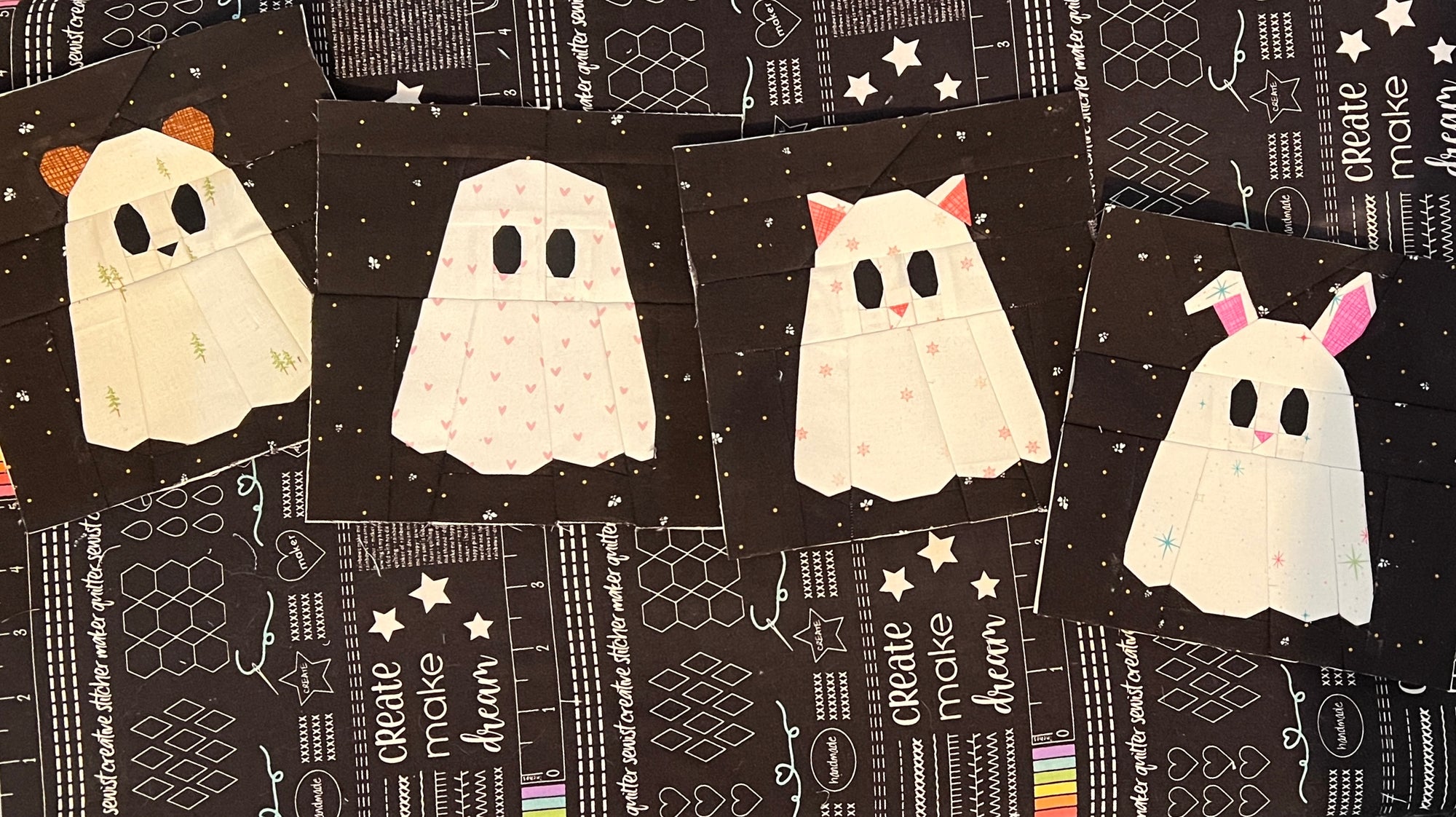 Foundation paper pieced ghost animal quilt blocks including cat, dog, bunny and bear