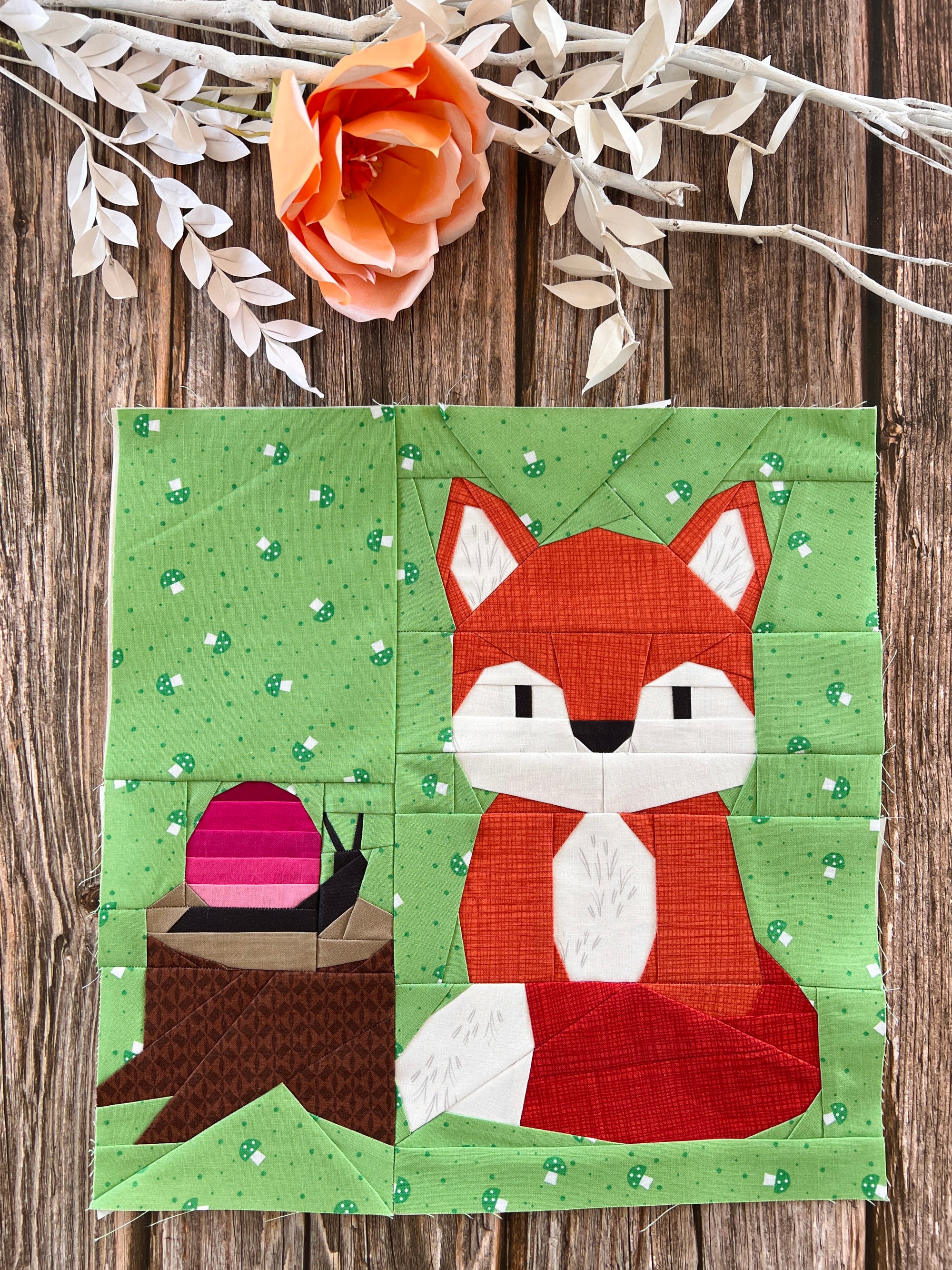Finished friendly fox foundation paper pieced quilting pattern sewn in fabric with garden background