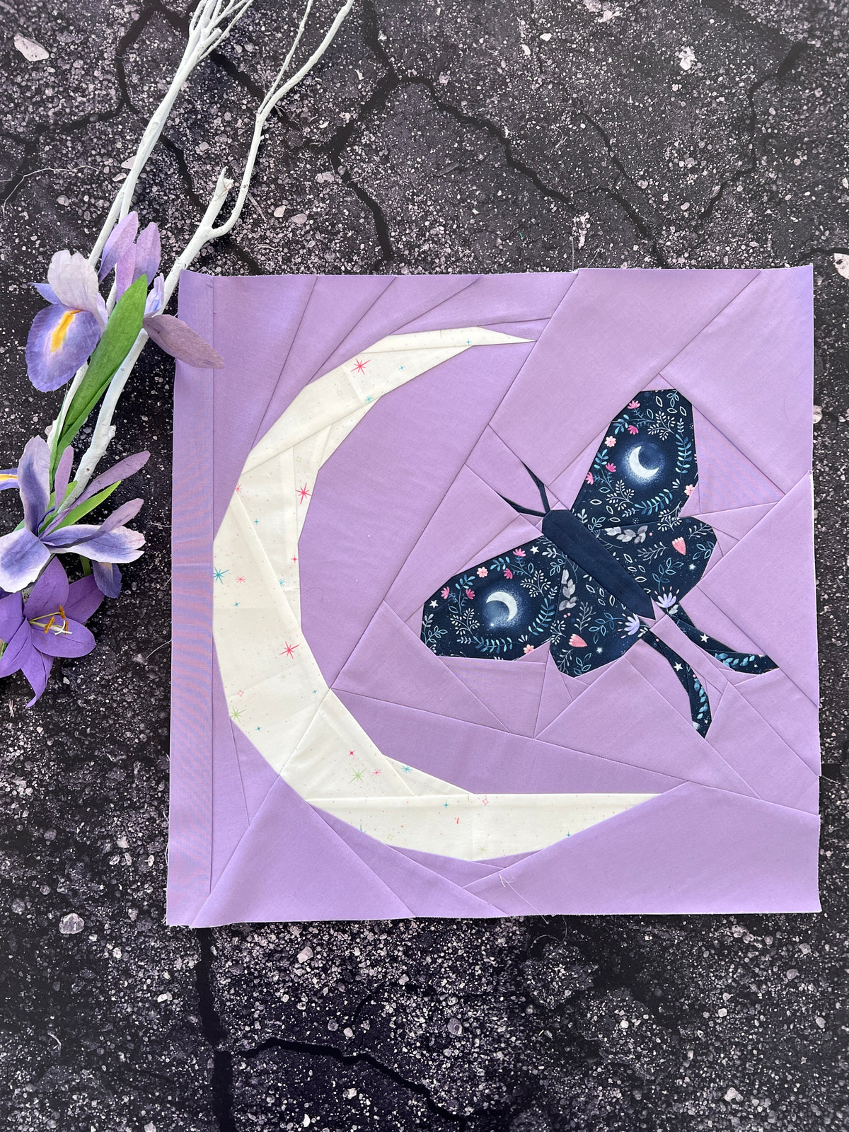 Finished Midnight Moth foundation paper pieced quilting pattern sewn in fabric with crescent moon