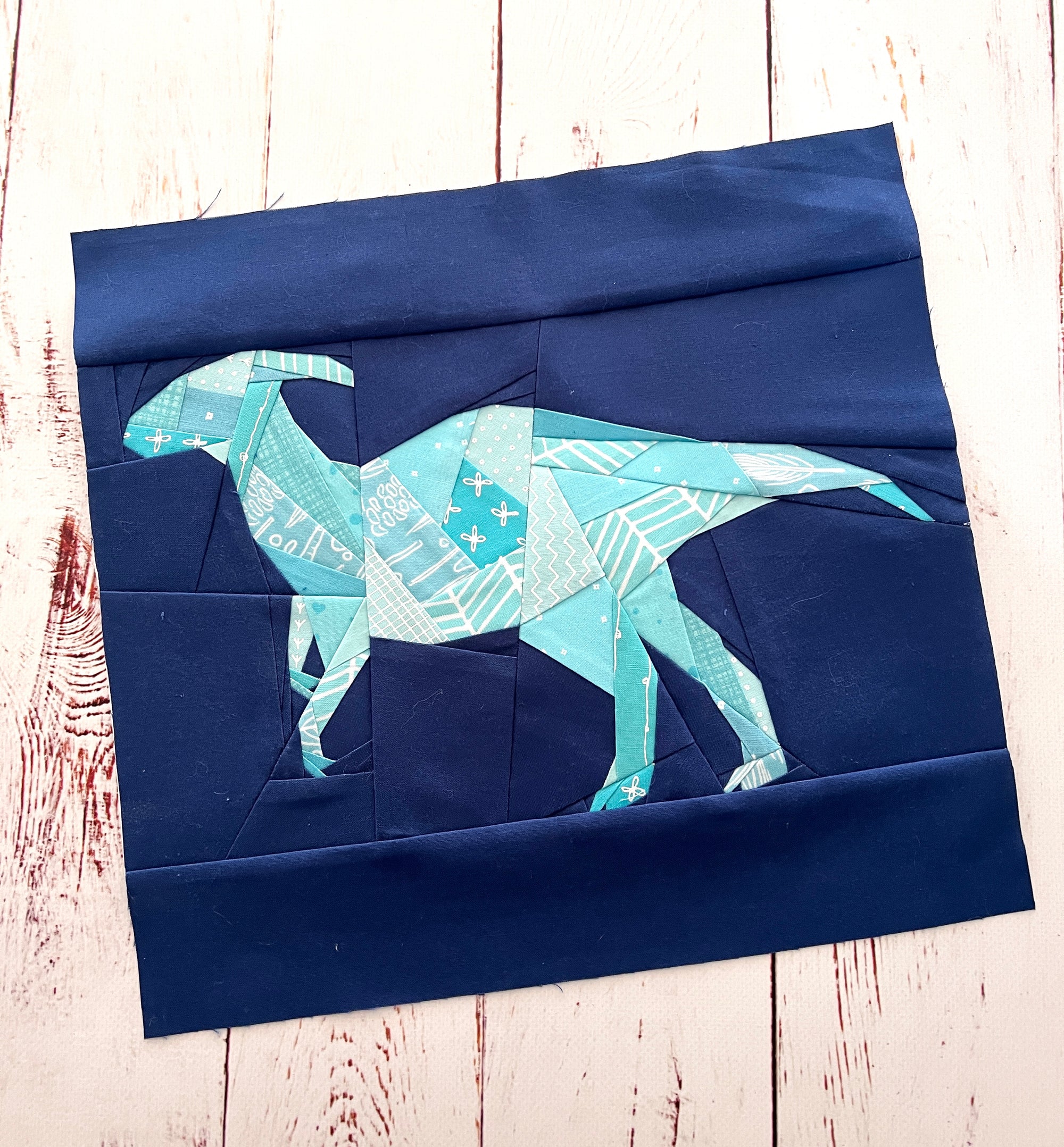 Finished parasaurolophus dinosaur quilt block made with foundation paper piecing