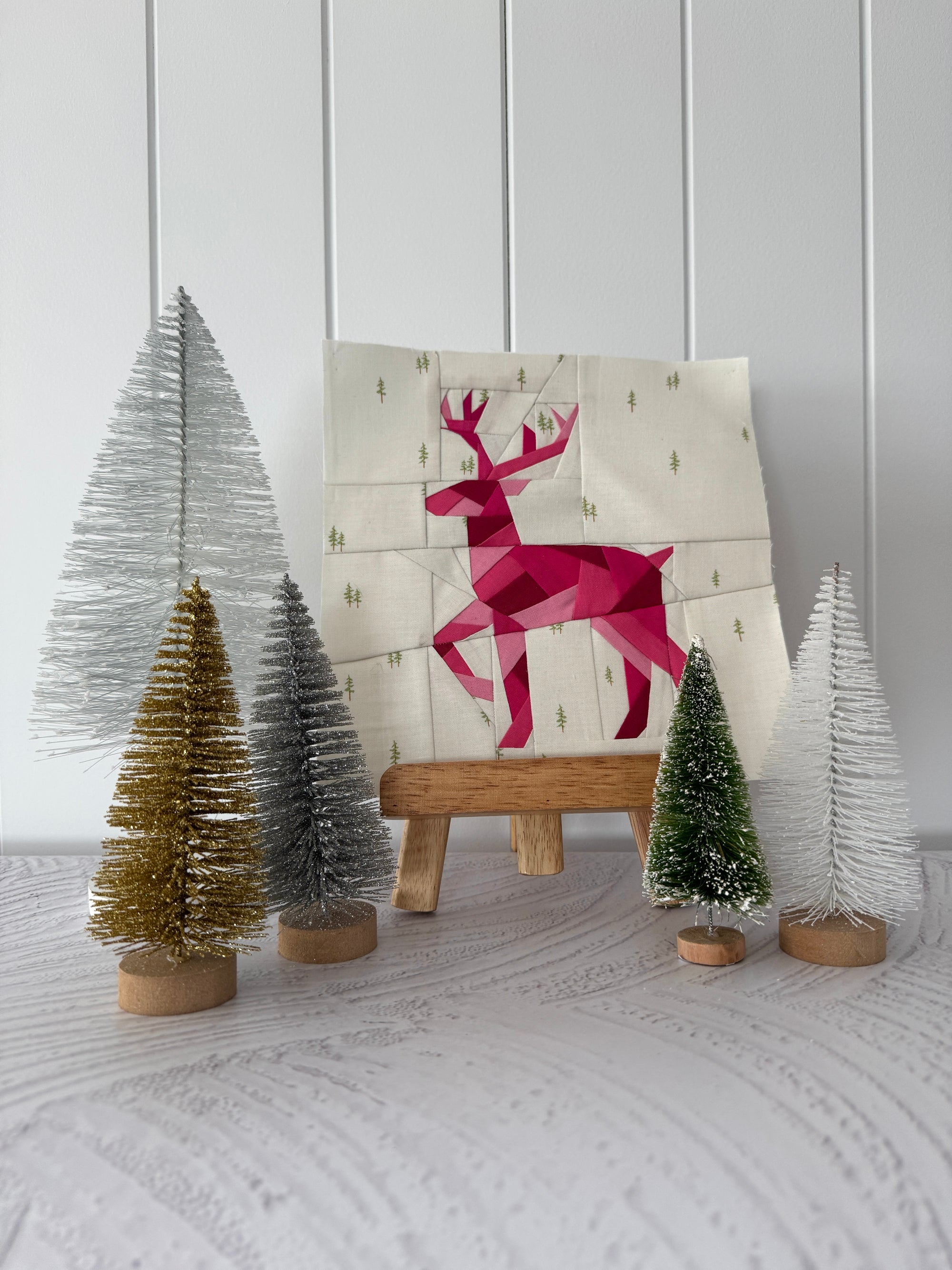 Finished standing geometric deer foundation paper pieced quilting pattern displayed as a quilt block