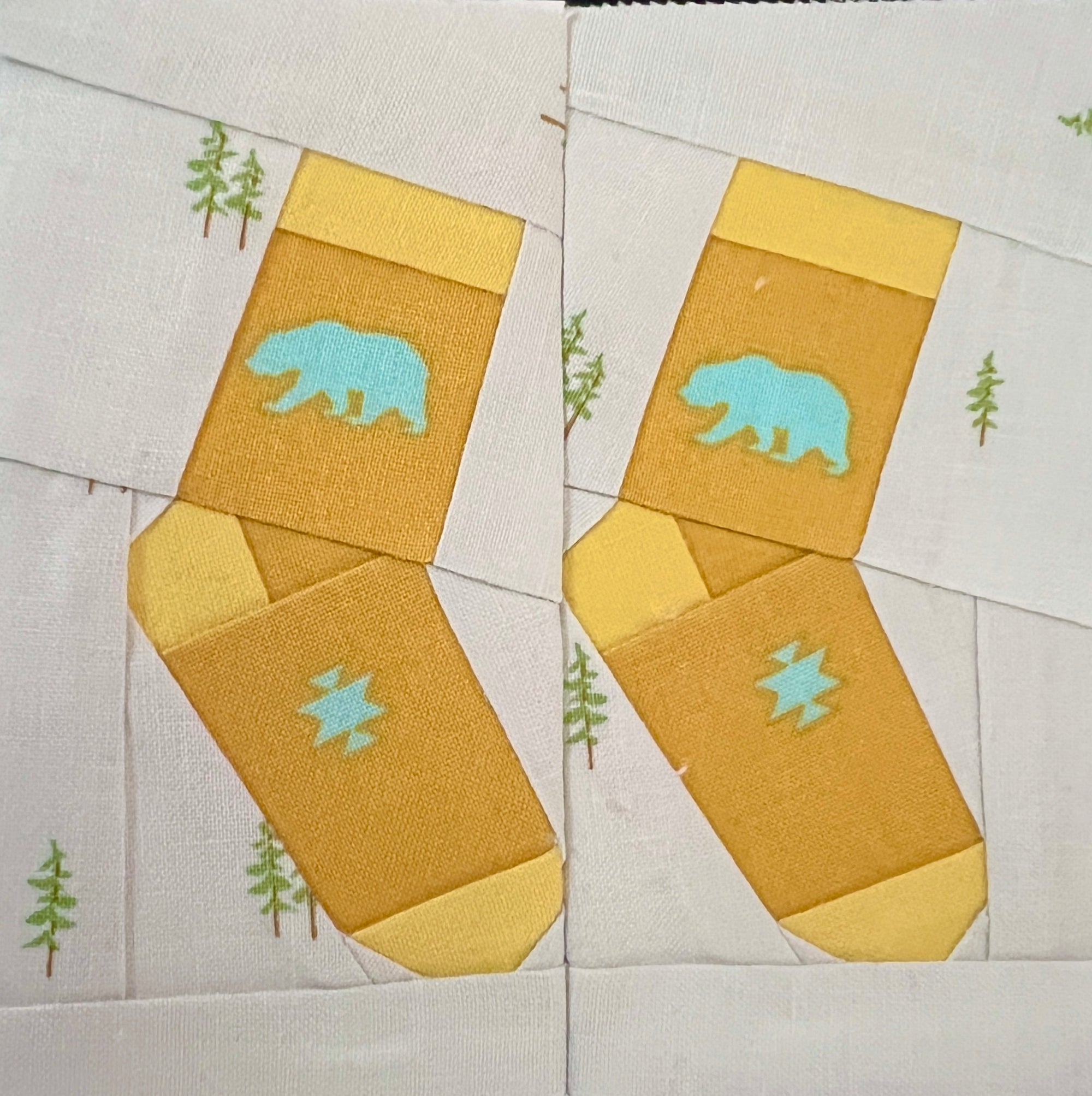 Silly socks paper pieced quilt pattern sewn in yellow fabric