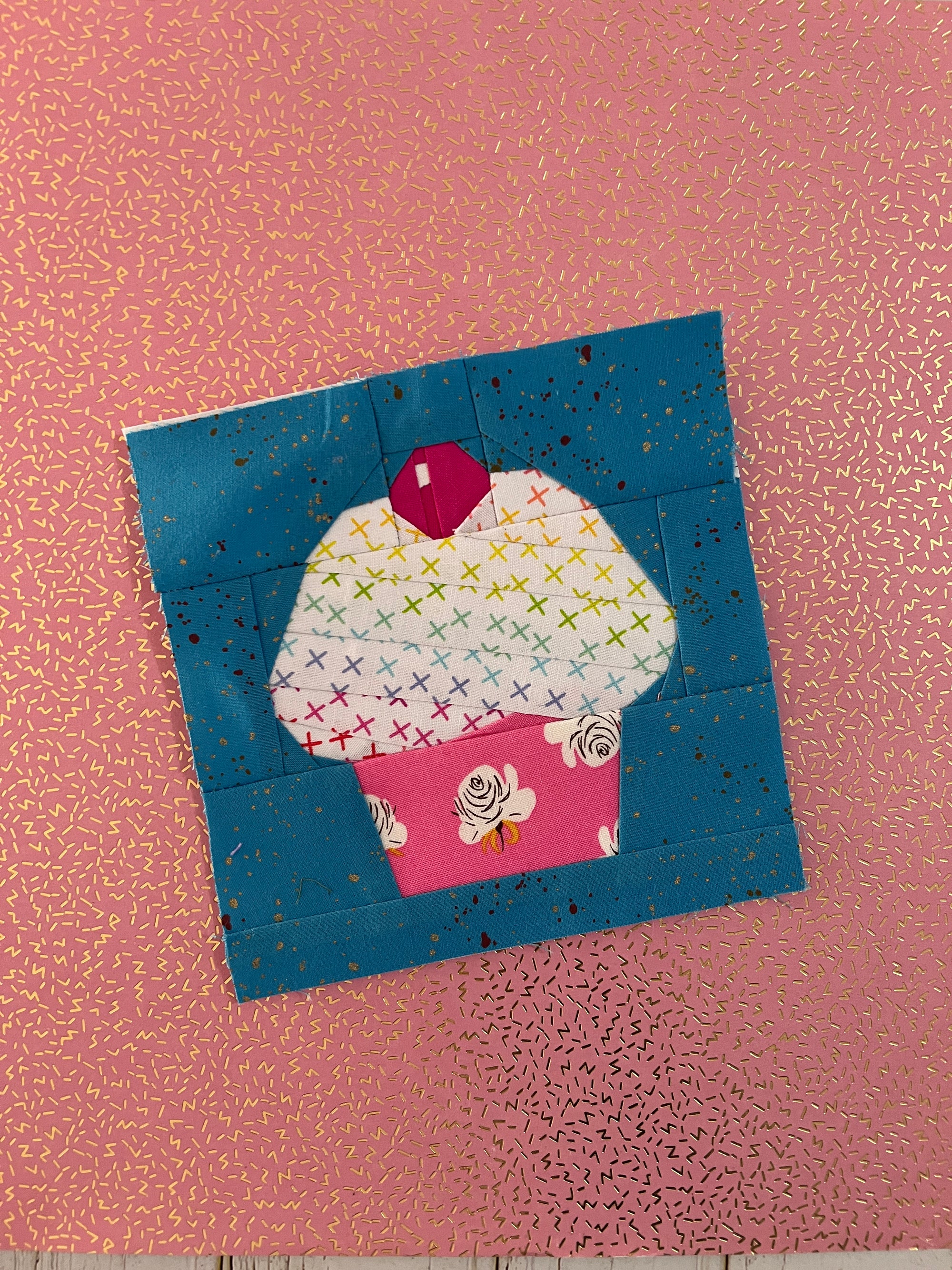 Finished sweet cupcake paper pieced quilt block sewn in fabric