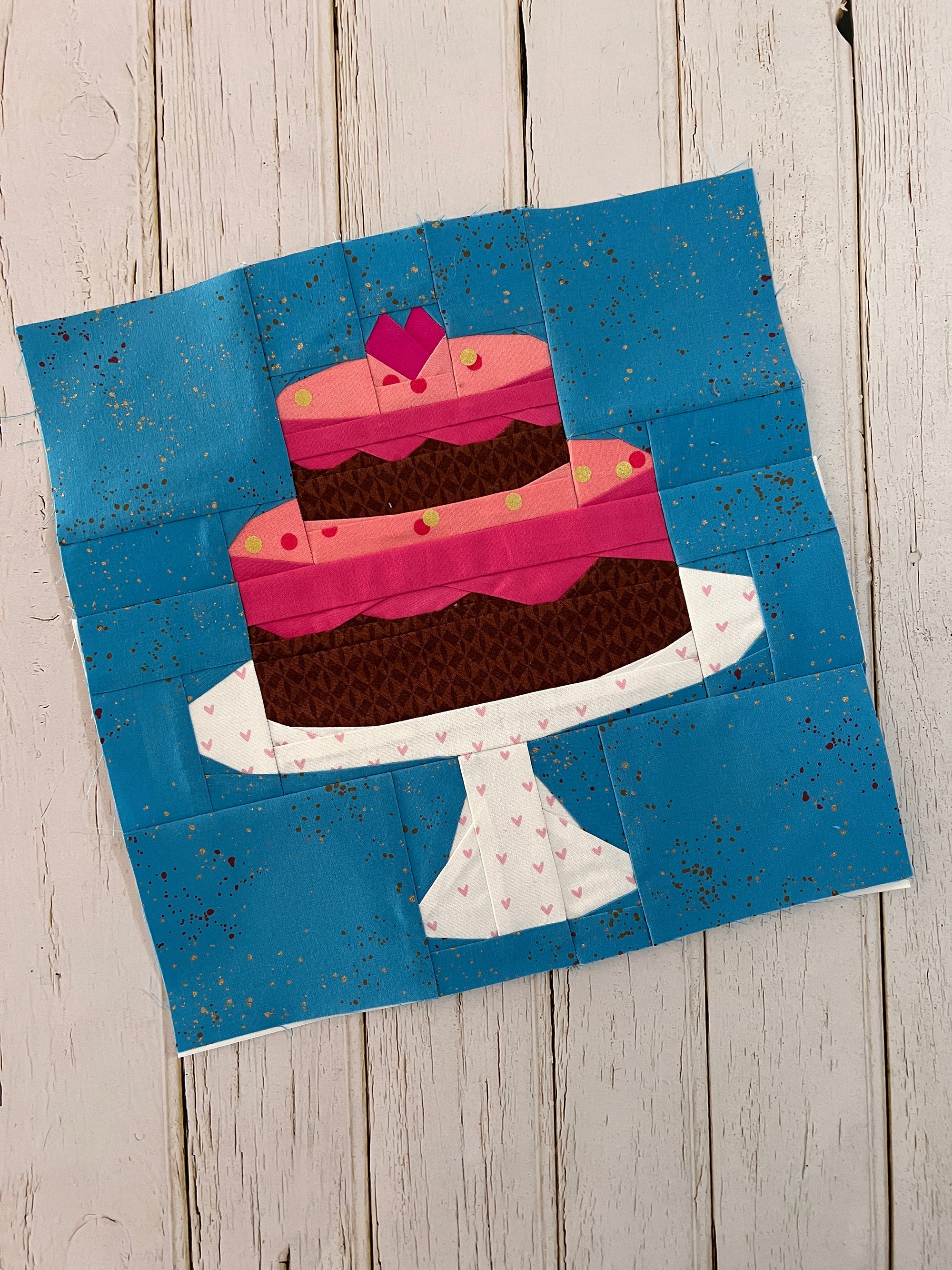 Finished tiered cake paper pieced quilt block sewn in fabric