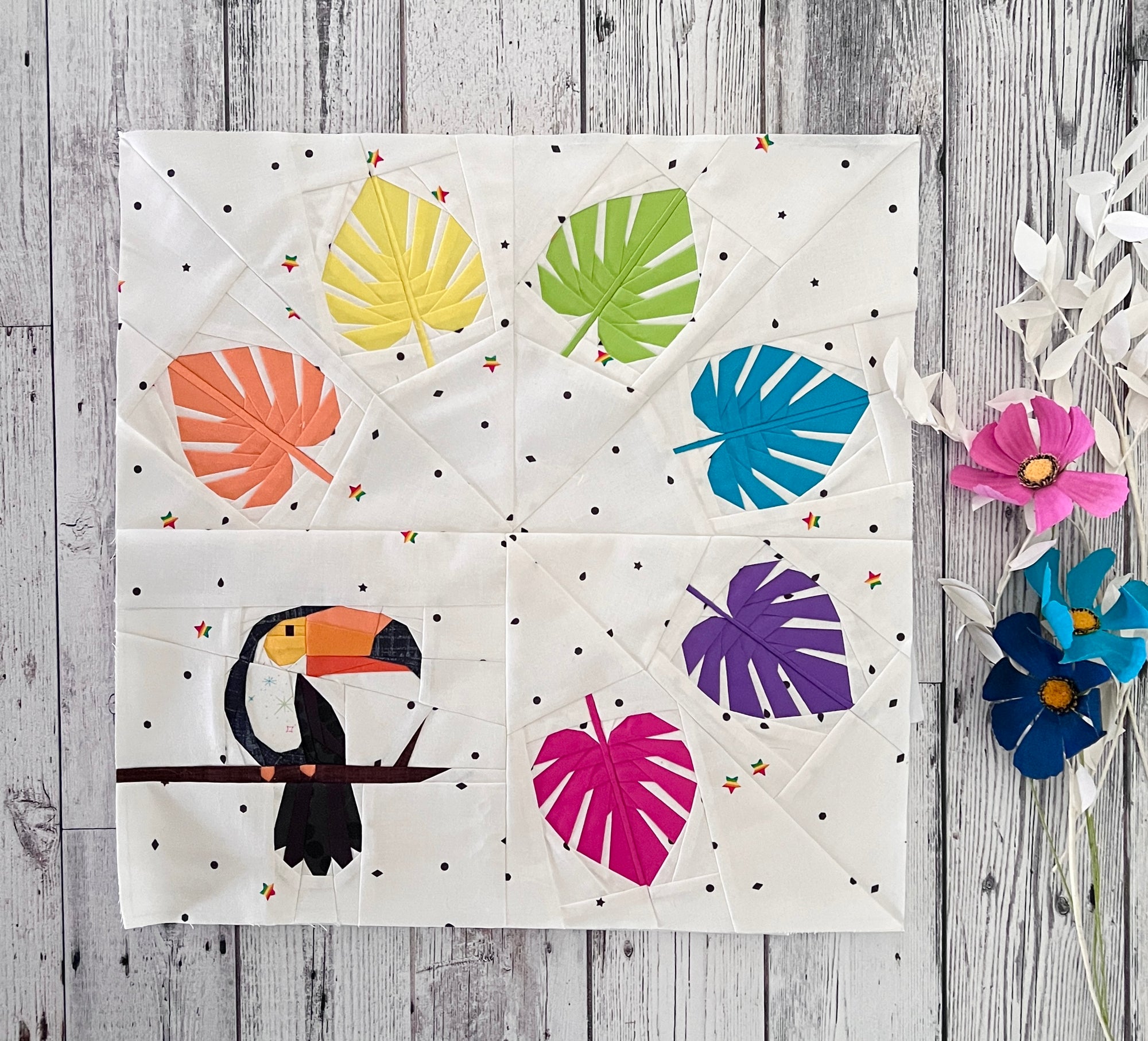 Finished toucan wreath quilt block made with foundation paper piecing